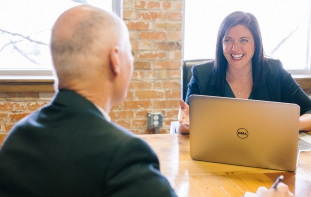 A woman has a meeting with a man