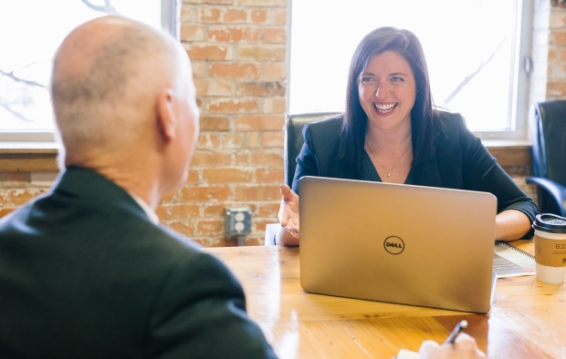 A woman in discussion with a man