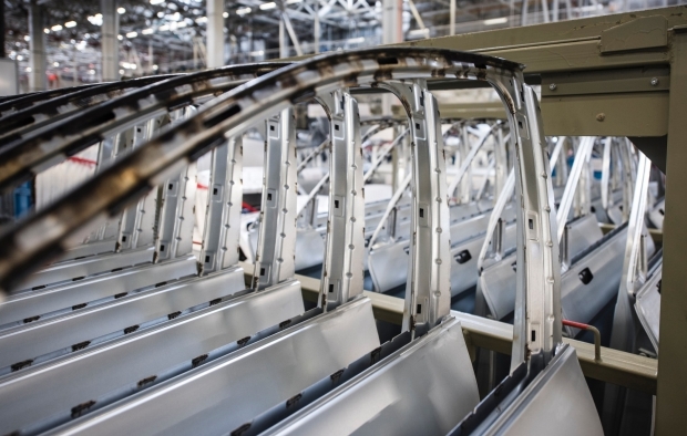 Cars being manufactured in a factory