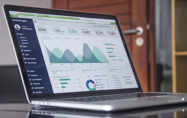 A laptop with a business spreadsheet