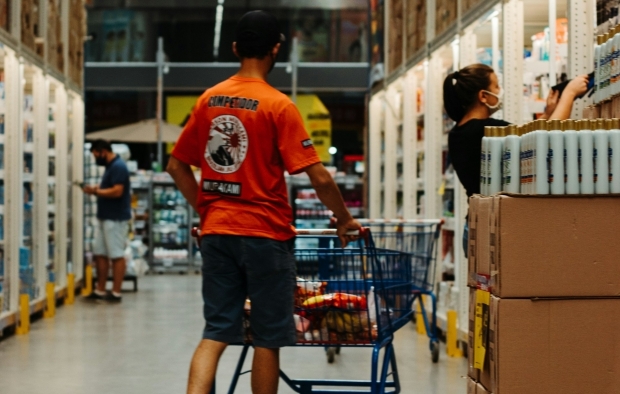 A person walking around a supermarket