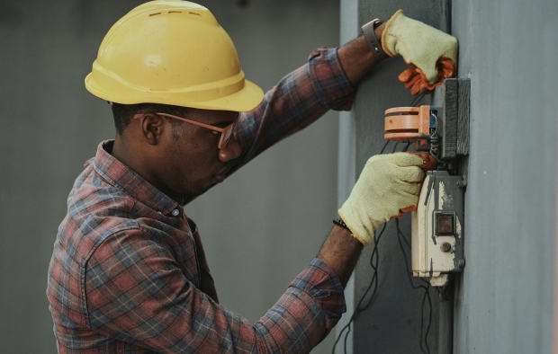 An electrician working on site