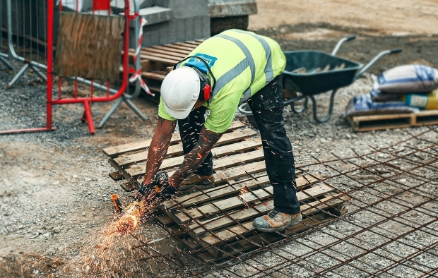 A builder using a cutting machine