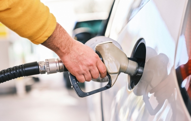 Person fills up their car with petrol