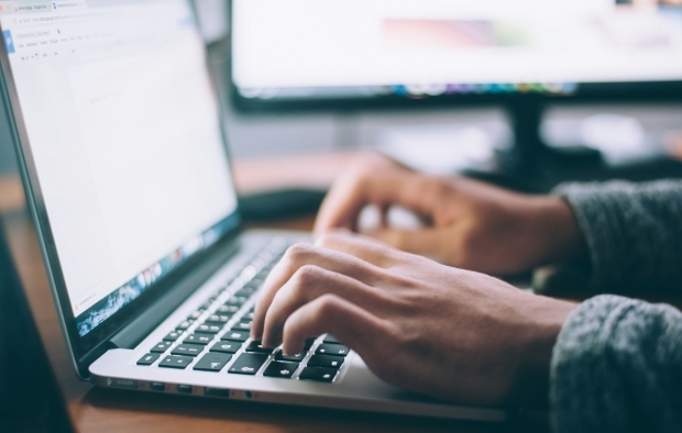 Person typing on a laptop