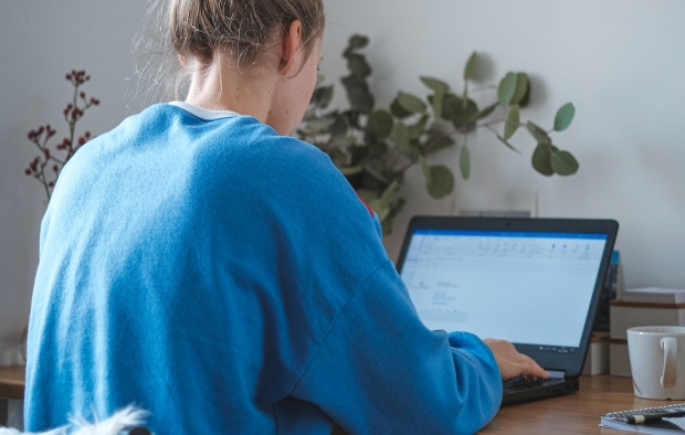 A woman working remotely from home