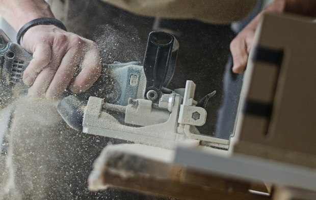 A person using a saw at work