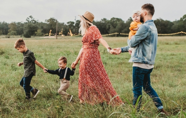 A family walking in a field
