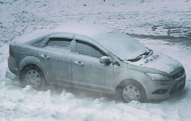 A car covered in snow and ice