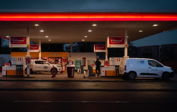 Drivers fill up with fuel at a petrol station