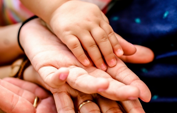 A family holding hands
