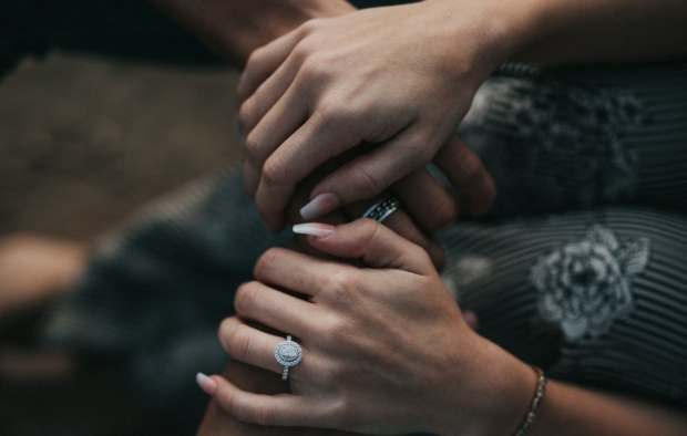 Two people holding hands