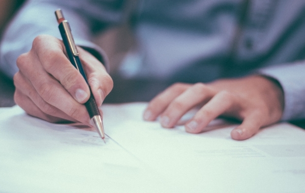 Person signing a form