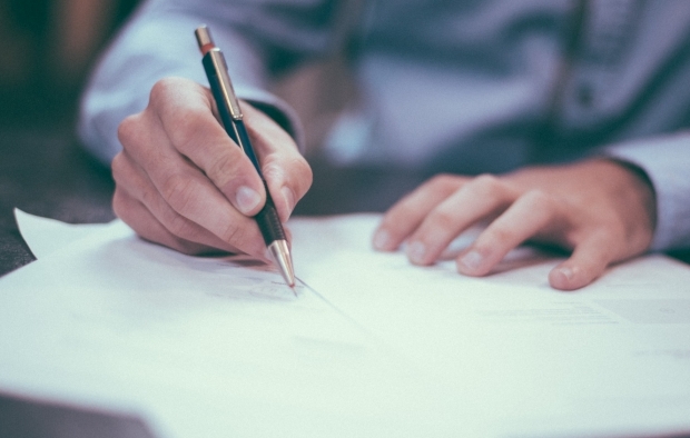 A person signing a document