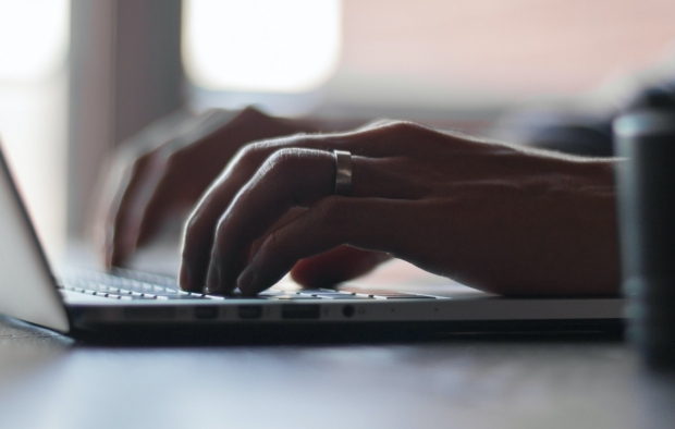 A person uses a laptop computer 