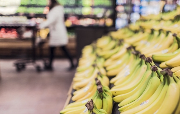An image of a banana stand in a supermarket